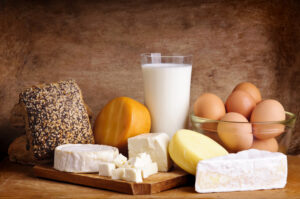 Collection of dairy, eggs, and cheese on a table