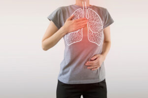 Woman with hand on chest showing internal outline of lungs